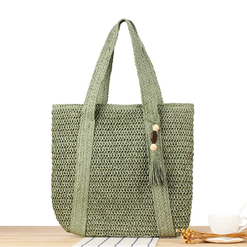 Eco-friendly straw tote bag with elegant tassel detail Kalsten