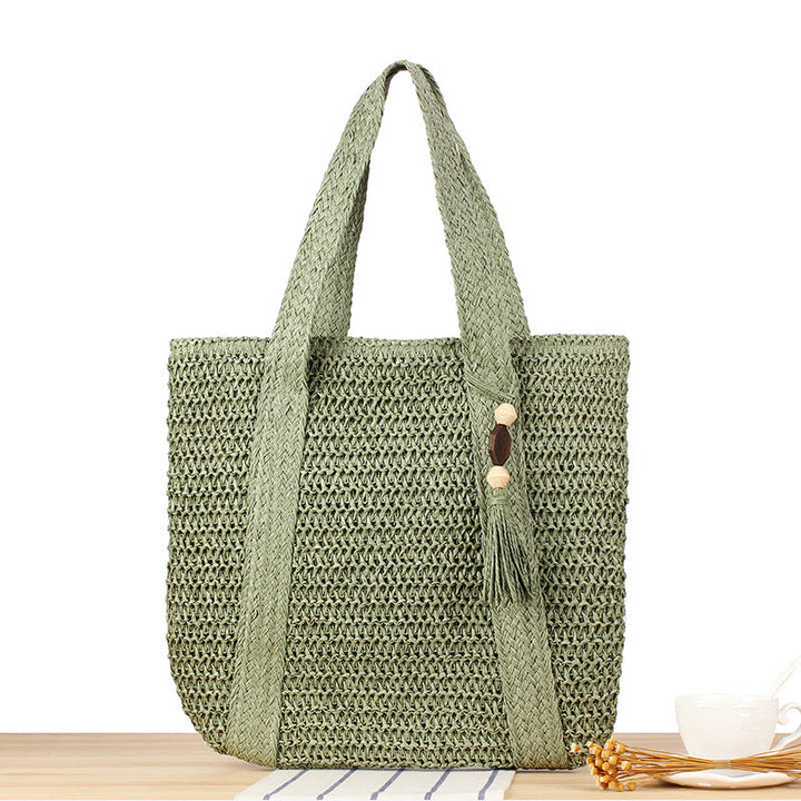 Eco-friendly straw tote bag with elegant tassel detail Kalsten