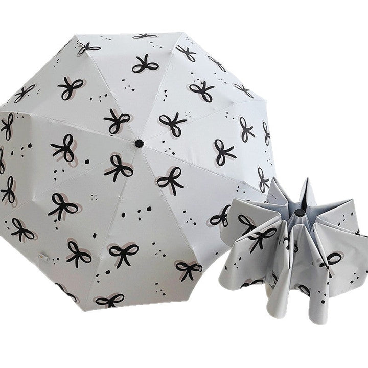 Women’s Folding Umbrella with Playful Bow Pattern Kalsten