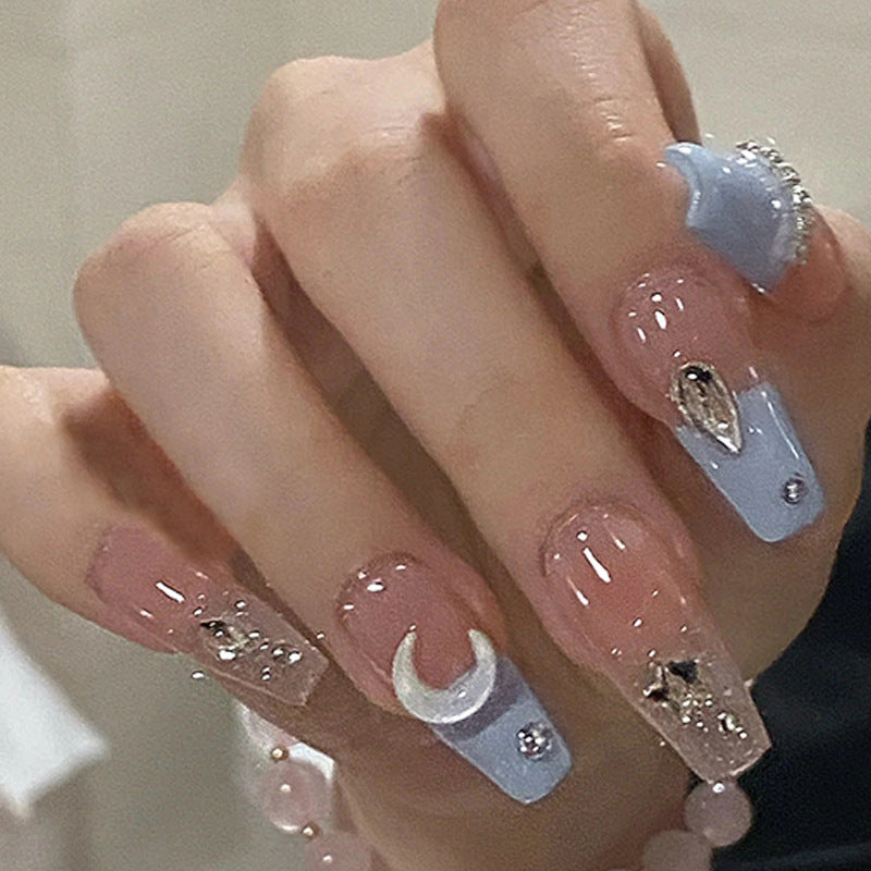 Artificial nails in creative moon and star design Kalsten