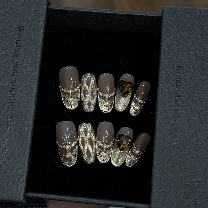 Glamorous artificial nails with glitter and heart design Kalsten
