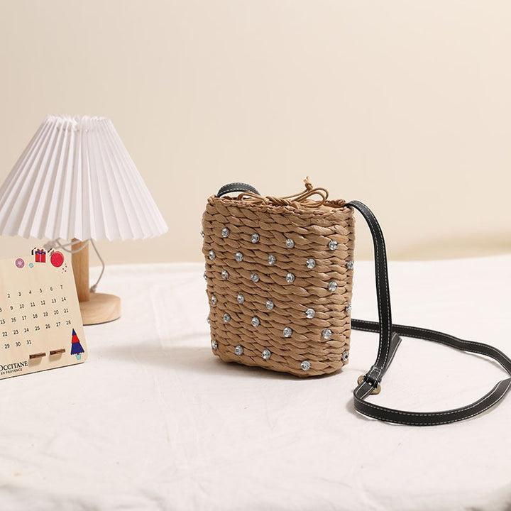 Bag made of woven natural material with sparkling appliqués Kalsten