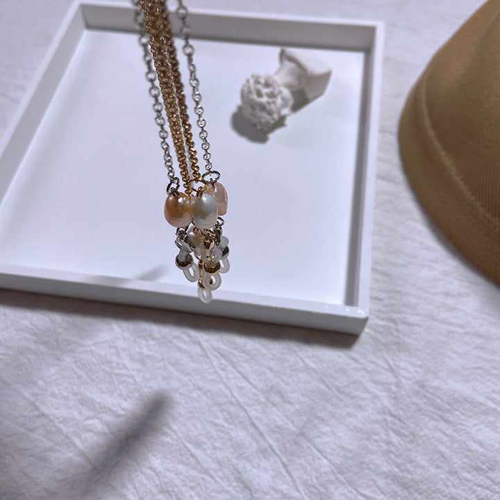 Elegant jewelry holder chain with pearl and gold accents Kalsten