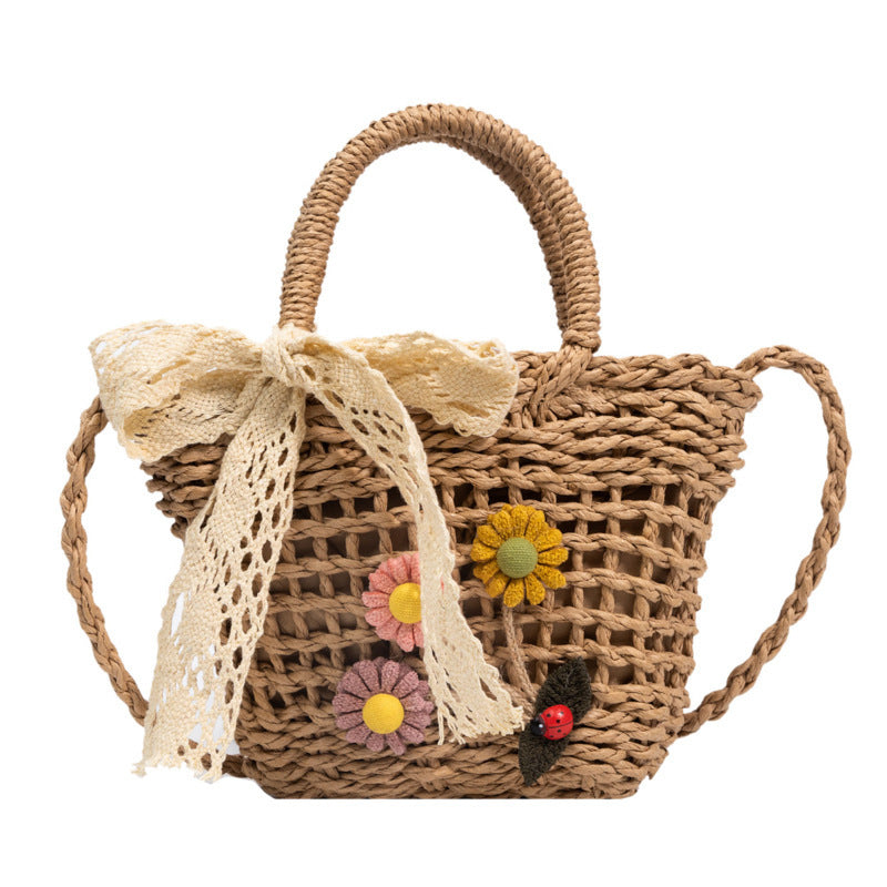 Playful basket bag with floral appliqués Kalsten