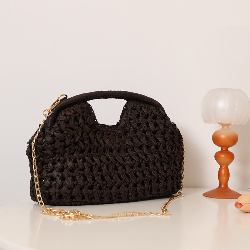 Handcrafted rattan bag with elegant handles and chain straps Kalsten