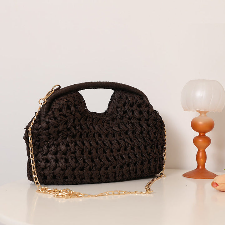 Handcrafted rattan bag with elegant handles and chain straps Kalsten