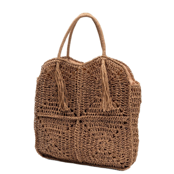 Spacious handbag made of braided natural material with fringes Kalsten