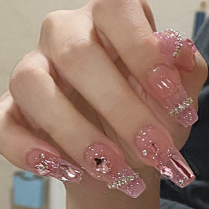 Glamorous artificial nails with delicate flower and glitter effects Kalsten