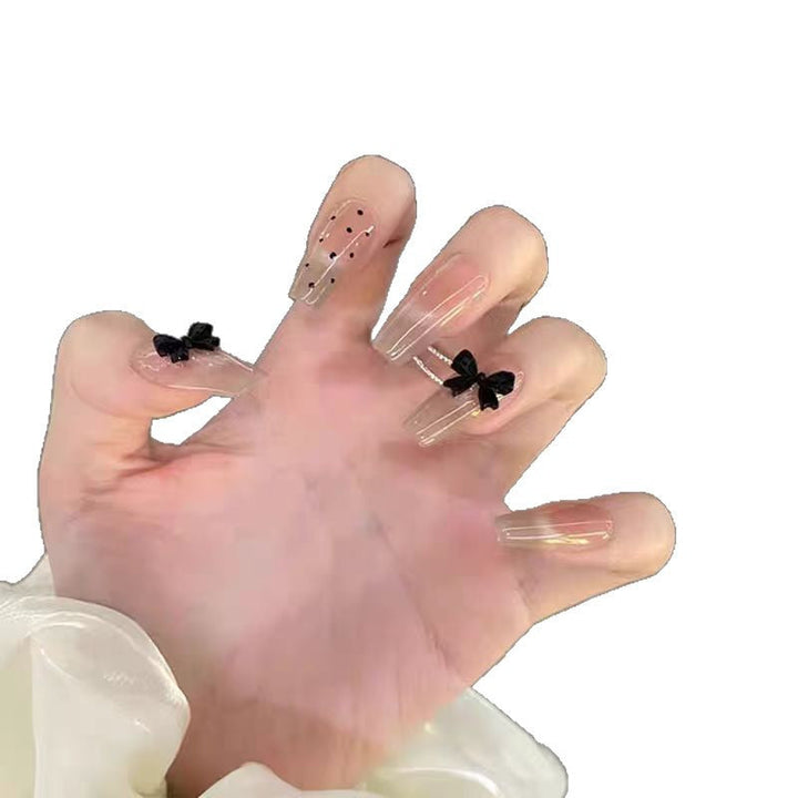 Artificial nails with playful bow design Kalsten