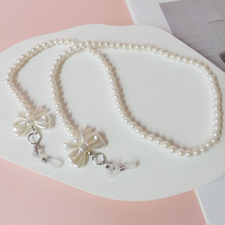 Elegant pearl glasses chain with bow pendants Kalsten