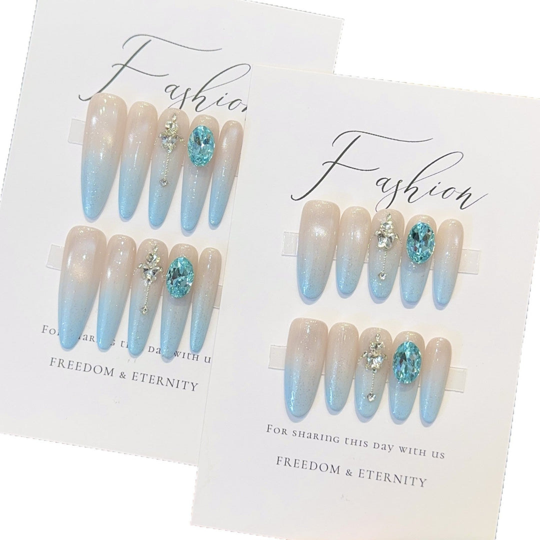 Glamorous artificial nails with sparkling rhinestone details Kalsten