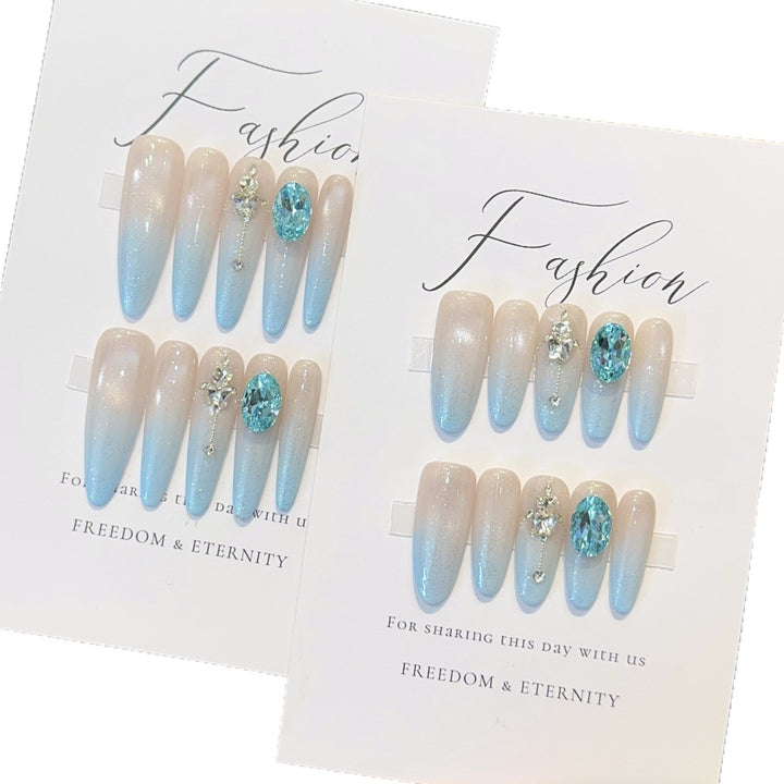 Glamorous artificial nails with sparkling rhinestone details Kalsten