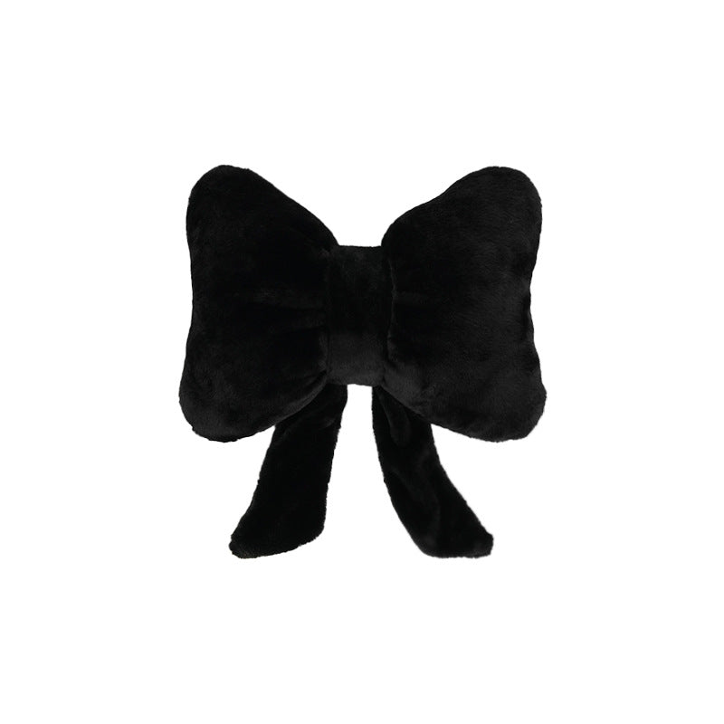 plush bow-shaped decorative throw cushion with long tails and faux-fur texture Kalsten