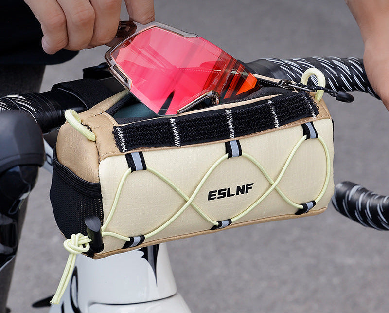 compact cylindrical handlebar bag with elastic bungee and universal Velcro mount Kalsten