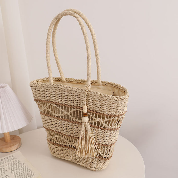 Handcrafted straw tote bag with decorative tassel detail Kalsten