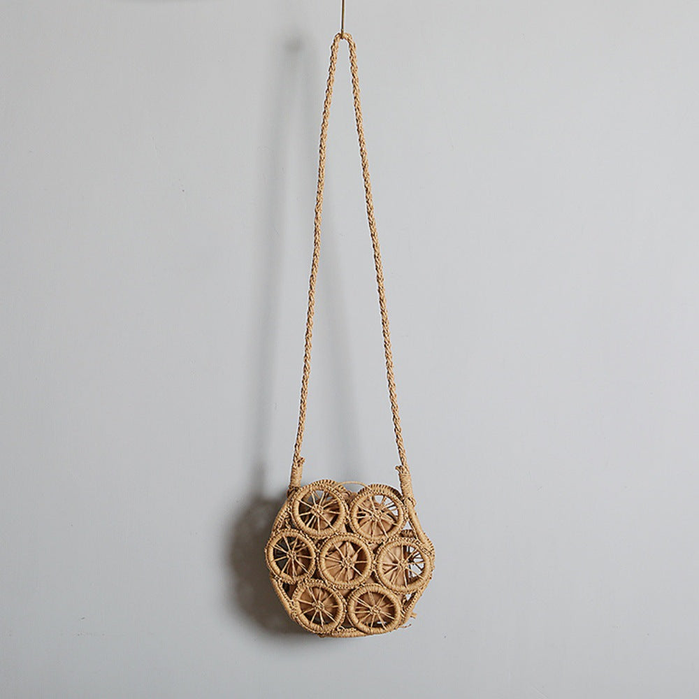 Shoulder bag made of handwoven raffia with intricate embellishments Kalsten