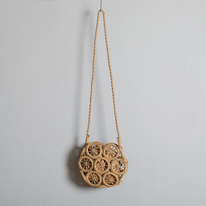 Shoulder bag made of handwoven raffia with intricate embellishments Kalsten