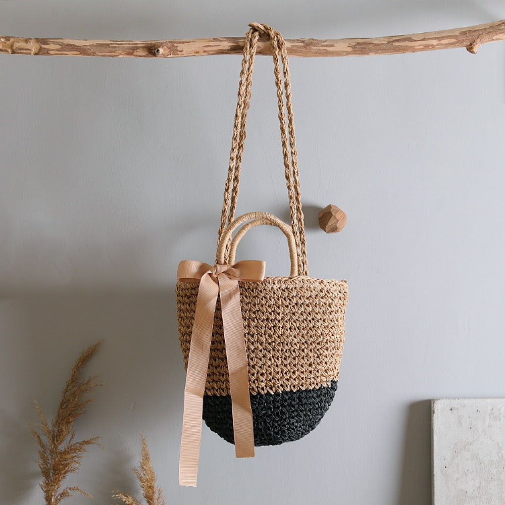Basket bag with stylish carrying handles and decorative bow Kalsten