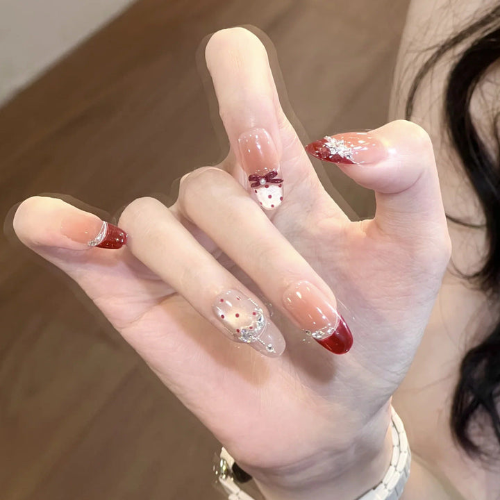 Artificial nails with glitter and tip accents Kalsten