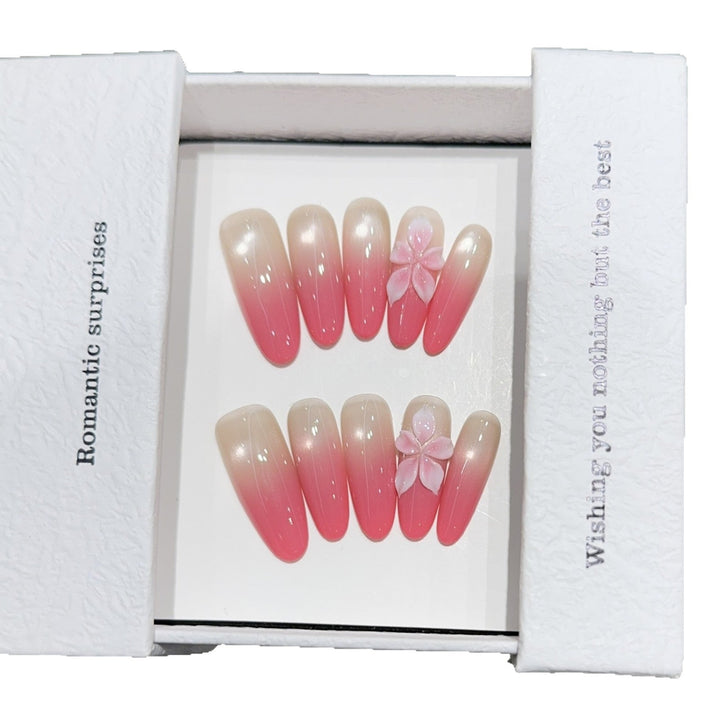 Artificial nails with romantic ombre design and floral accents Kalsten