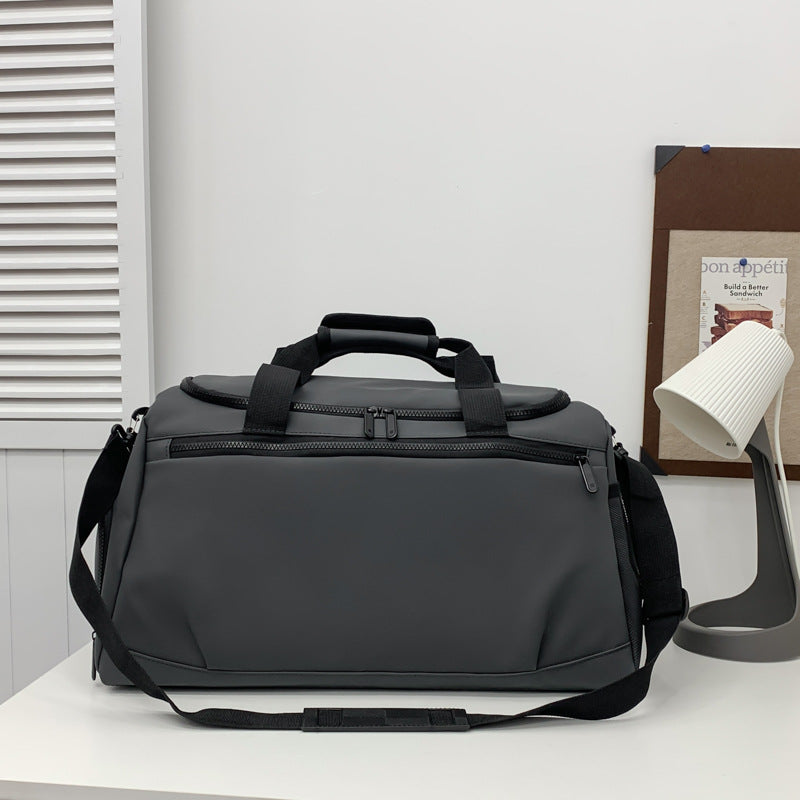 Sporty travel bag with reinforced carrying handles and multiple compartments Kalsten