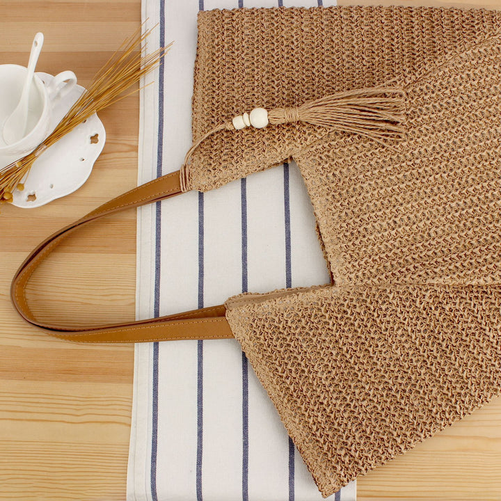 Beach bag made of natural weave with elegant leather accents Kalsten
