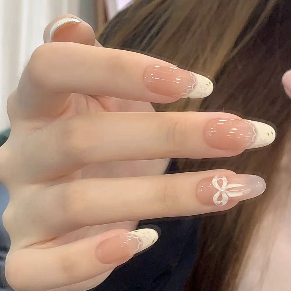 Artificial nails with elegant tip embellishment and romantic details Kalsten