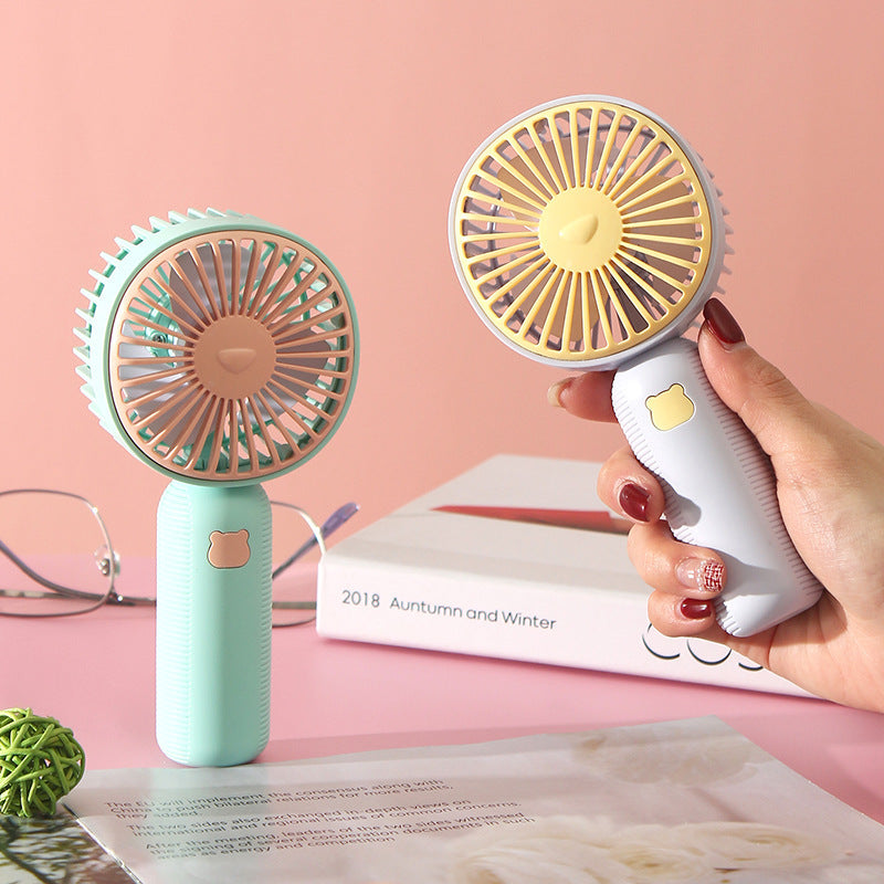 Ladies compact handheld fan with ergonomic grip, quiet brushless motor, and removable stand Kalsten