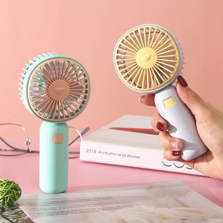 Ladies compact handheld fan with ergonomic grip, quiet brushless motor, and removable stand Kalsten