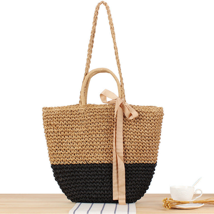 Beach bag made of natural raffia with playful design and elegant bow decoration Kalsten