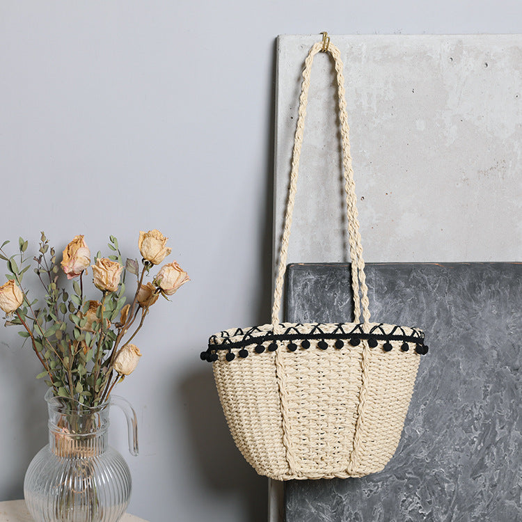 Delicate beach bag with pompons Kalsten