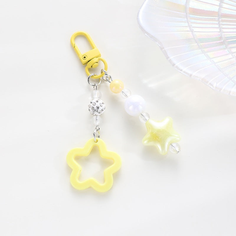 Playful keychain with floral and star motif Kalsten
