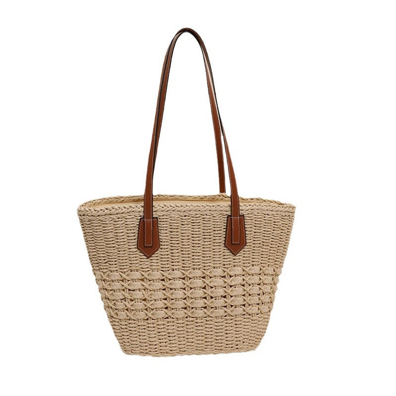 Handcrafted rattan basket bag with elegant leather accents Kalsten