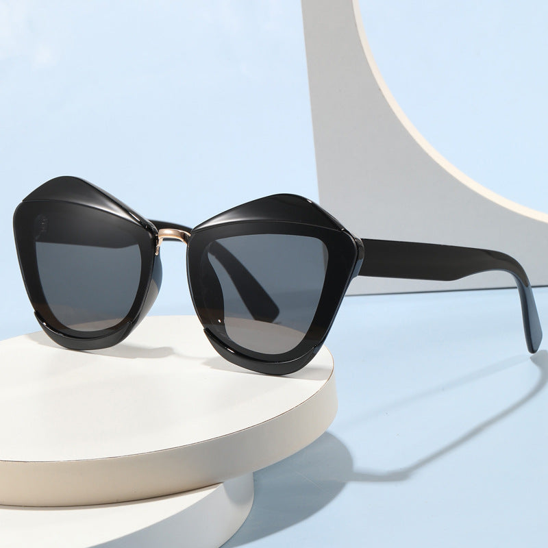 Women striking designer sunglasses with extravagant frame Kalsten
