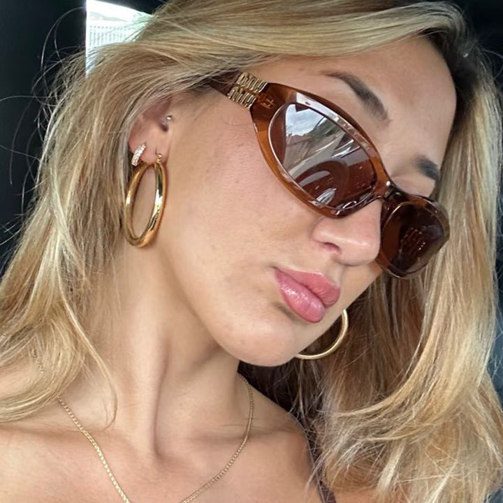 Women’s fashionable sunglasses in a curved design with luxurious details Kalsten