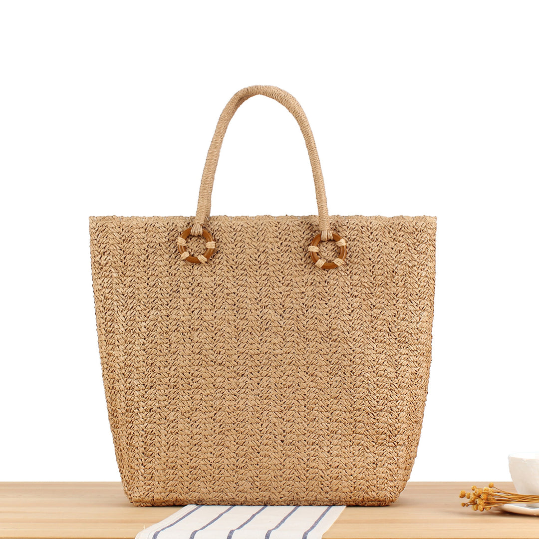 Beach bag made of natural woven material with sturdy carry handles Kalsten