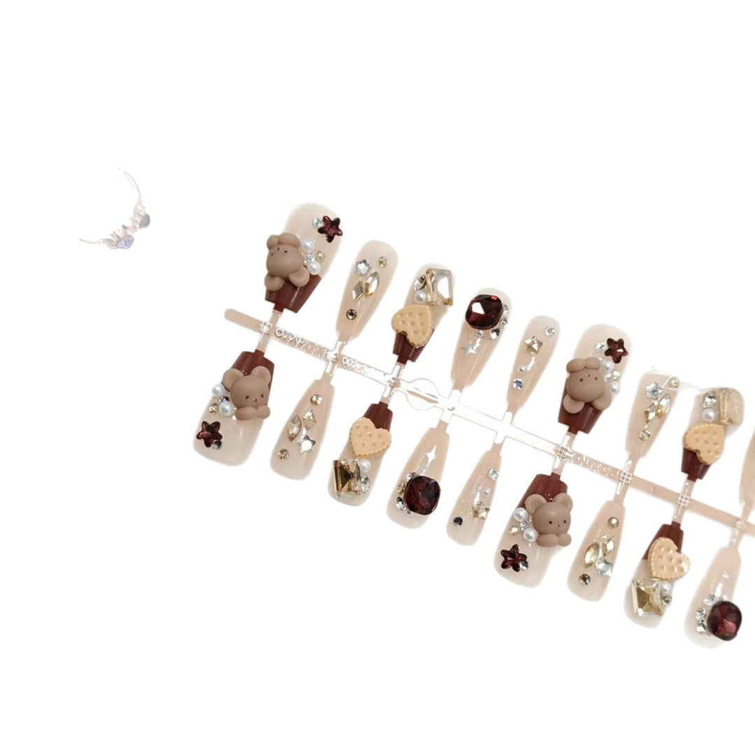 Creative acrylic nails with animal motifs and glitter accents Kalsten