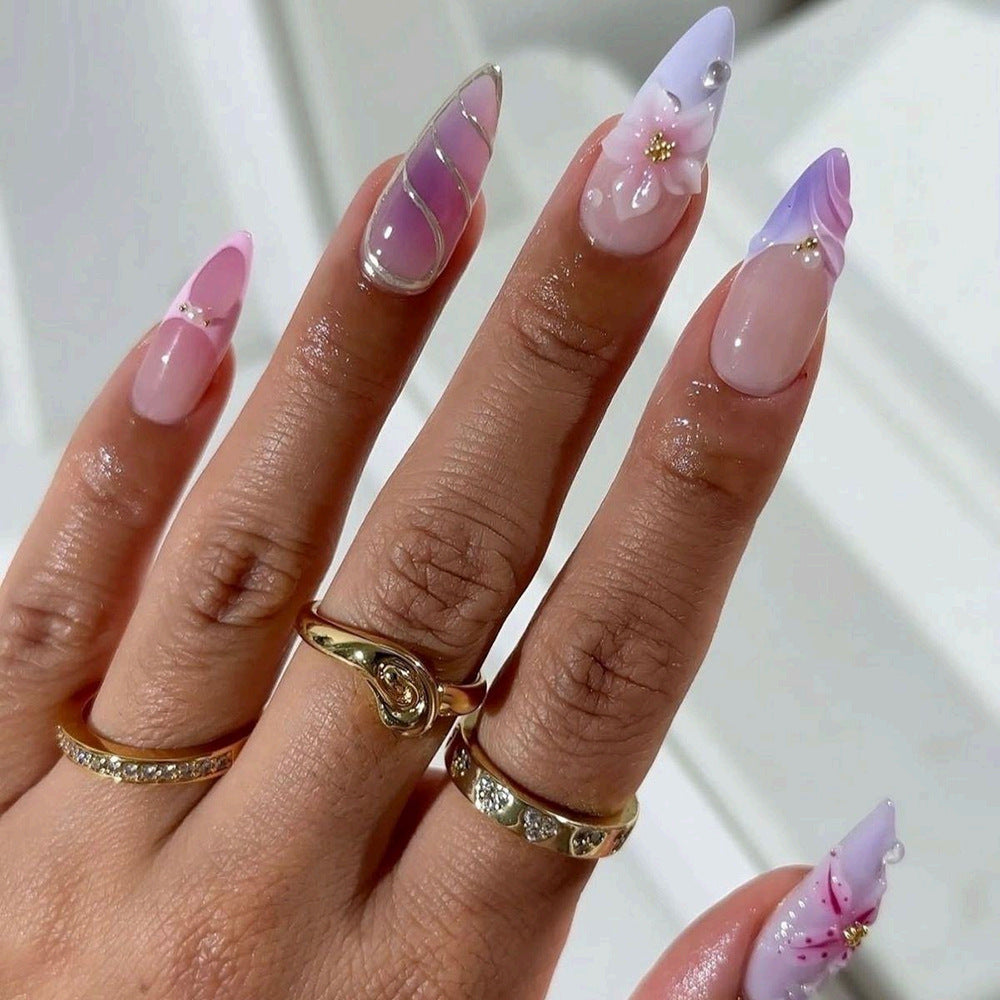 Artificial nails in elegant stiletto design with floral accent Acalora