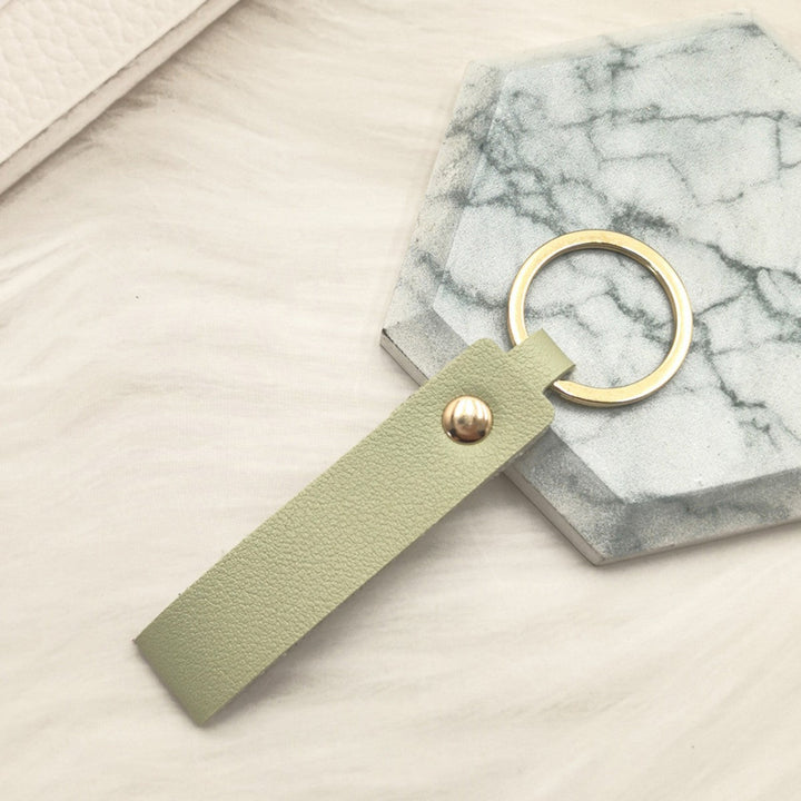 Unisex keychain made of high-quality synthetic leather with elegant metal embellishment Kalsten