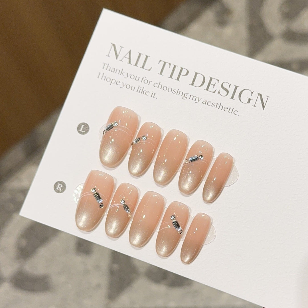 Artificial nail tips with elegant gradient color and rhinestone accents Kalsten