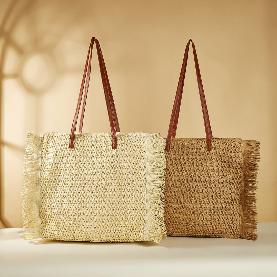 Beach bag made of raffia with fringed details Kalsten
