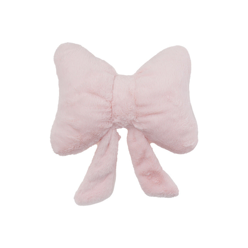 plush bow-shaped decorative throw cushion with long tails and faux-fur texture Kalsten