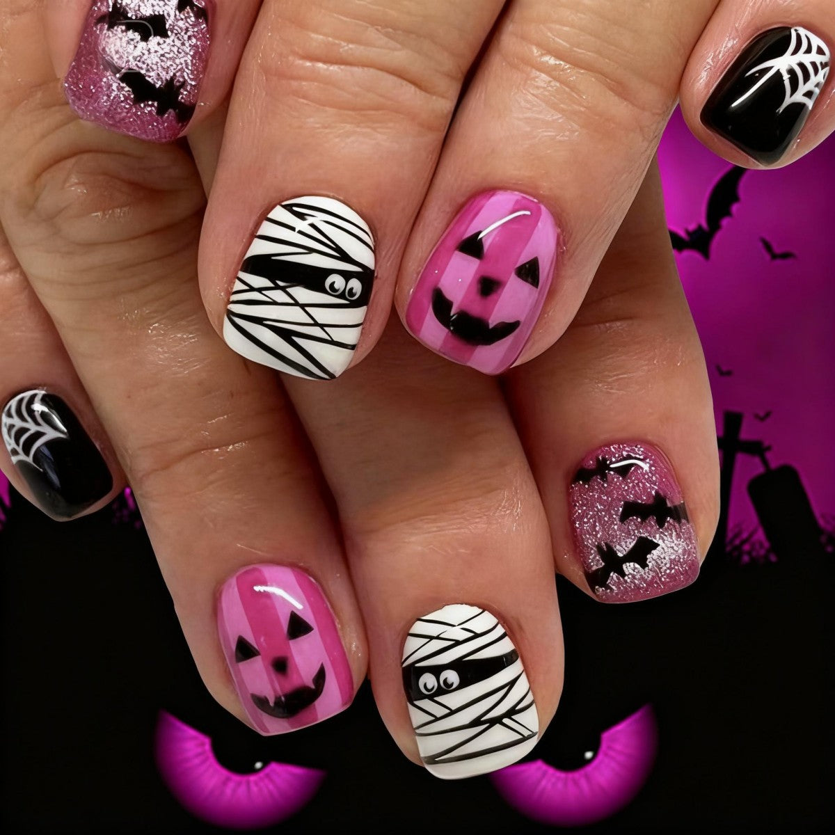 Creative nail art set with Halloween motifs and glitter accents Acalora