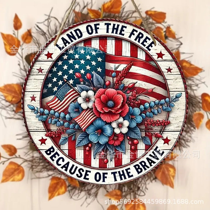Independence Day rustic round wooden patriotic cross wall plaque with floral accents and God Bless America banner Kalsten