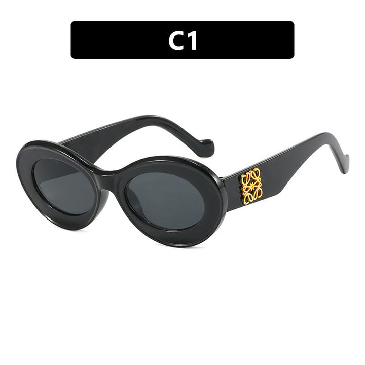 Women's fashionable sunglasses with oval frame and golden accents Kalsten
