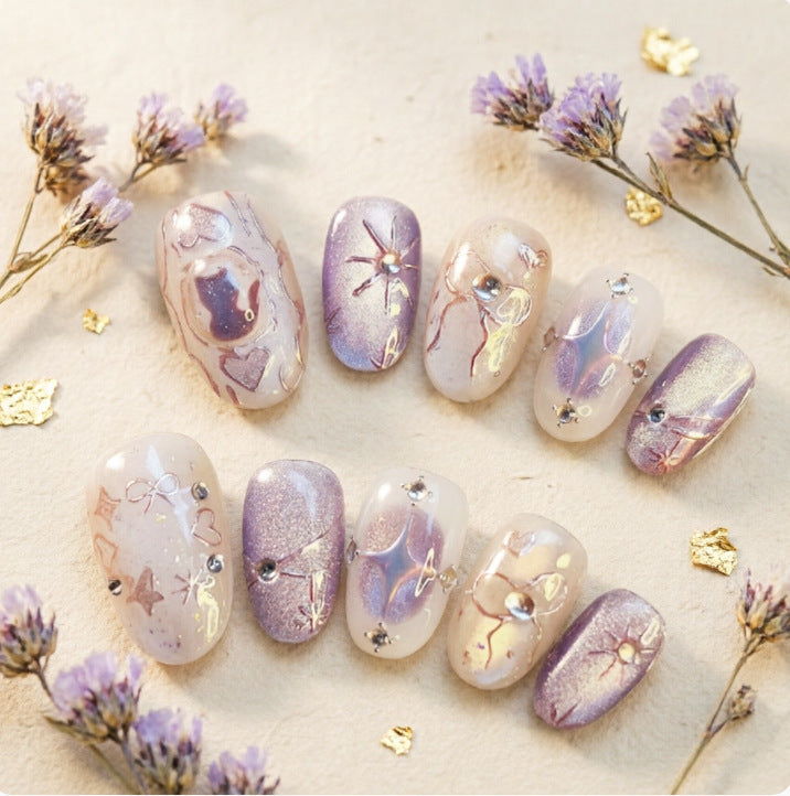Artificial nails with playful bow and star design Kalsten