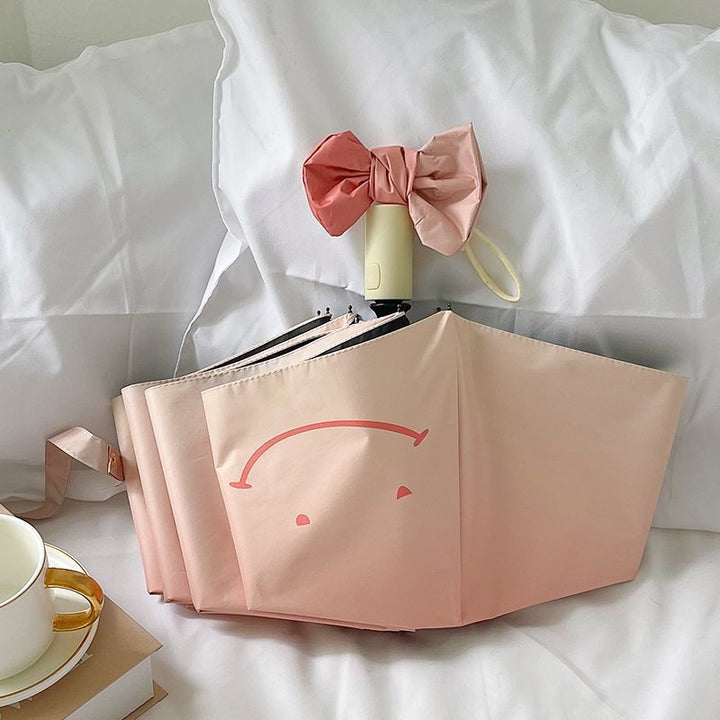 Women's foldable umbrella with playful design and handy wooden handle Kalsten