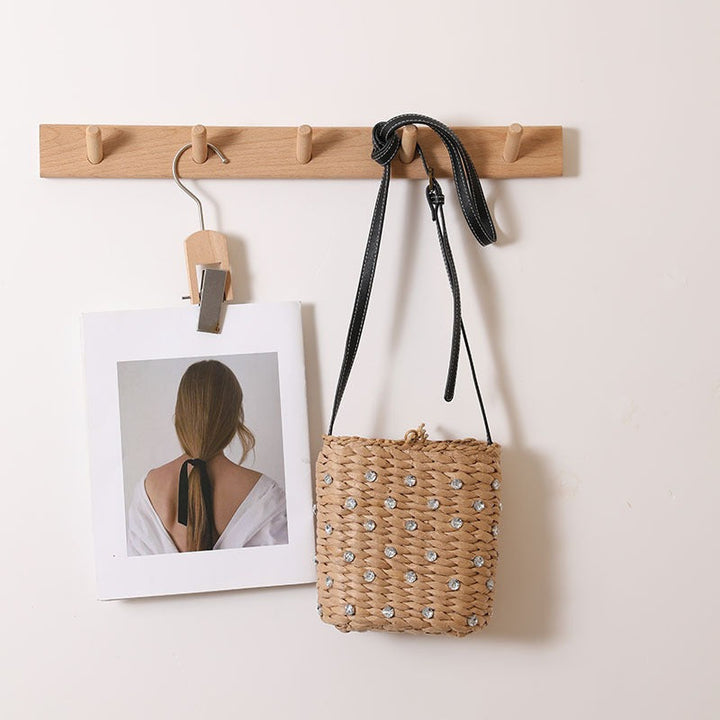 Bag made of woven natural material with sparkling appliqués Kalsten