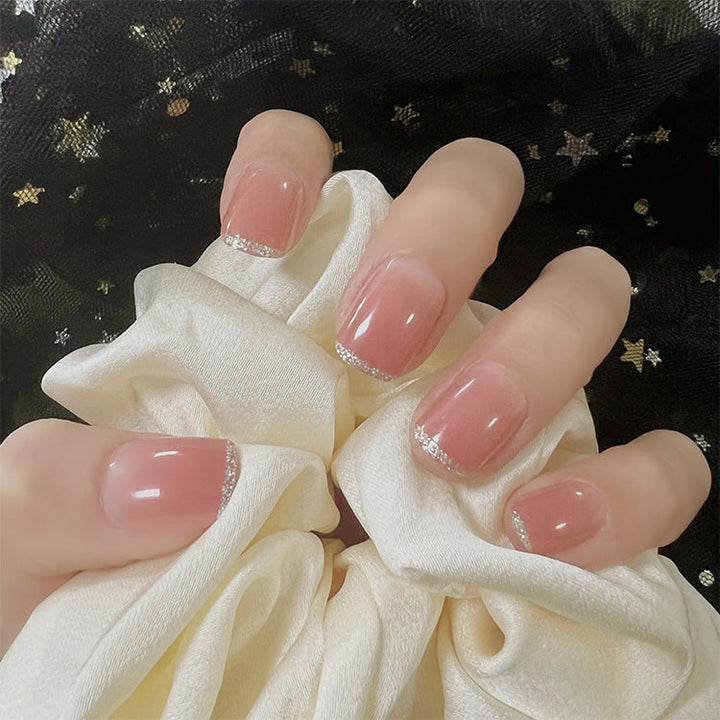 Glamorous artificial nails with delicate flower and glitter effects Kalsten