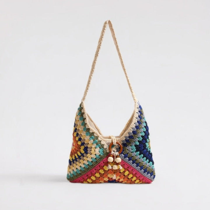 Handmade macrame shoulder bag with playful pendant Kalsten